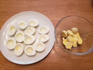 egg whites on a plate and yolks in a bowl