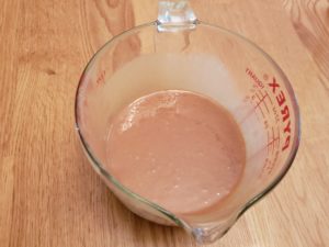 peanut butter and butter melted and stirred in measuring bowl